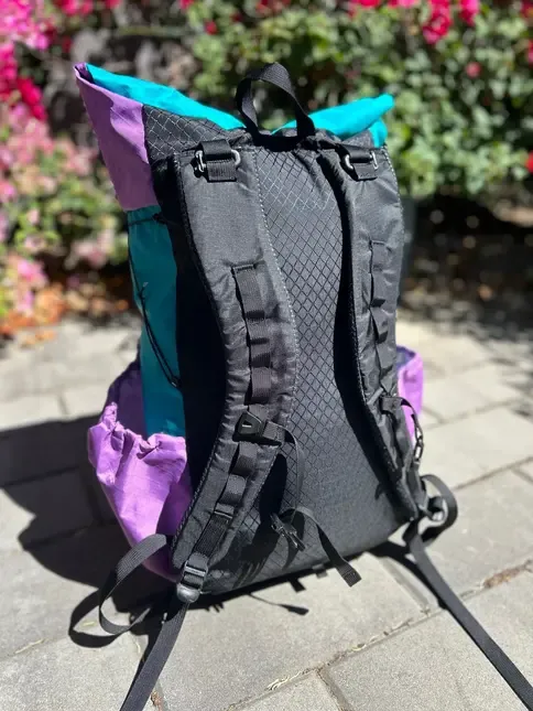 Green and purple pack back view with a black back panel