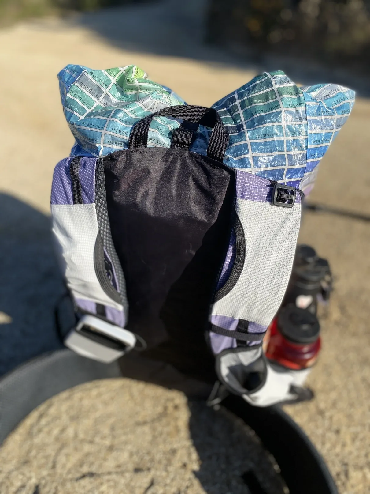 'back with black back panel with straps'
